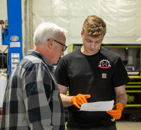 Mechanic talking with customer